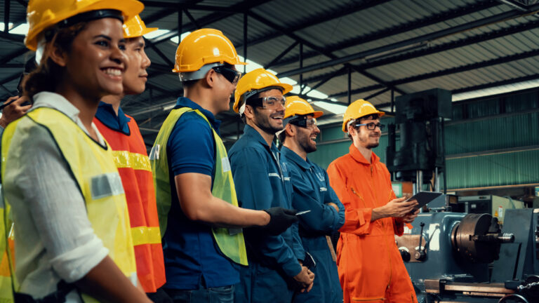 Skillful worker attending brief meeting in the factory 